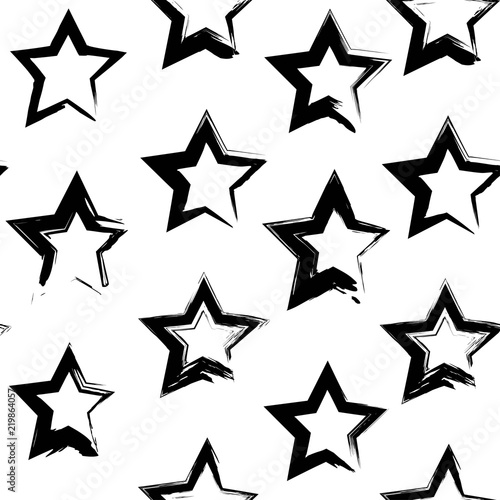 Seamless pattern from abstract black star shape textured smears  on a white background