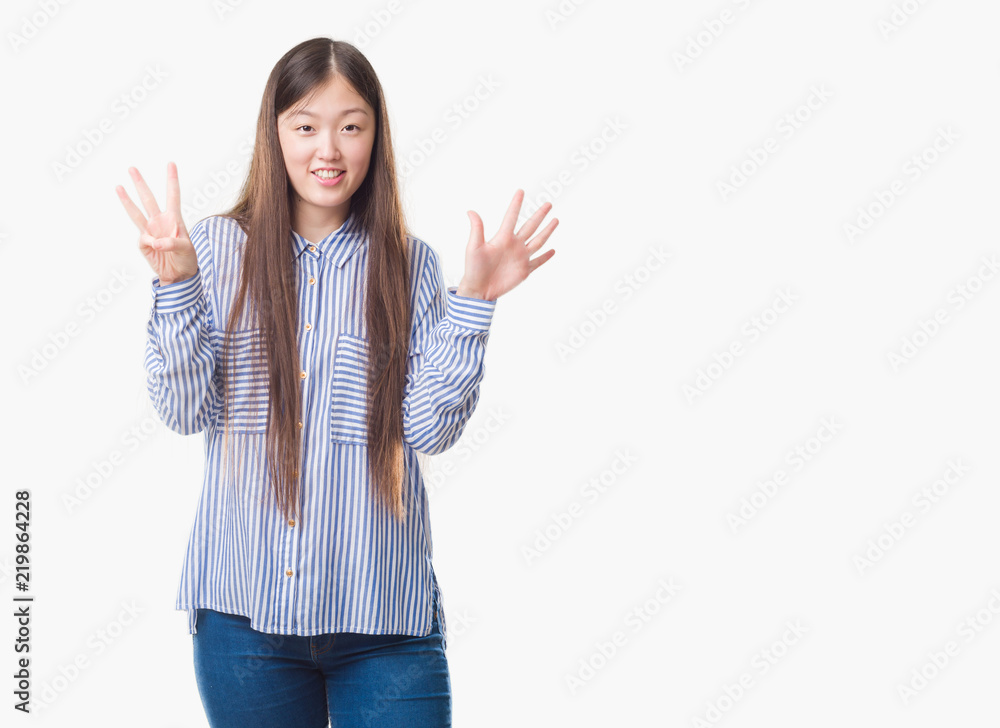 Young Chinese woman over isolated background showing and pointing up with fingers number eight while smiling confident and happy. Young Chinese woman over isolated background showing and pointing up with fingers number eight while smiling confident and happy.