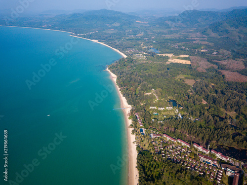 Aerial drone view of a beautiful empty sandy beach and tropical coastline © whitcomberd