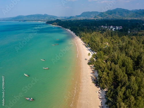 Aerial drone view of a beautiful empty sandy beach and tropical coastline