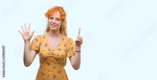 Young redhead woman showing and pointing up with fingers number six while smiling confident and happy.
