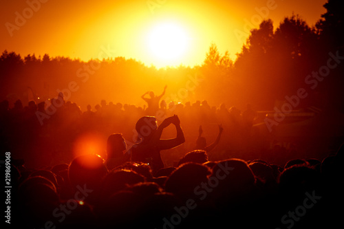 Fotografija Silhouettes of People at Outdoor Music Festival, Sunset, Crowd takes pleasure