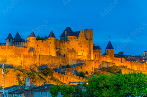 Night view over illuminated fortification of Carcassonne, France photo