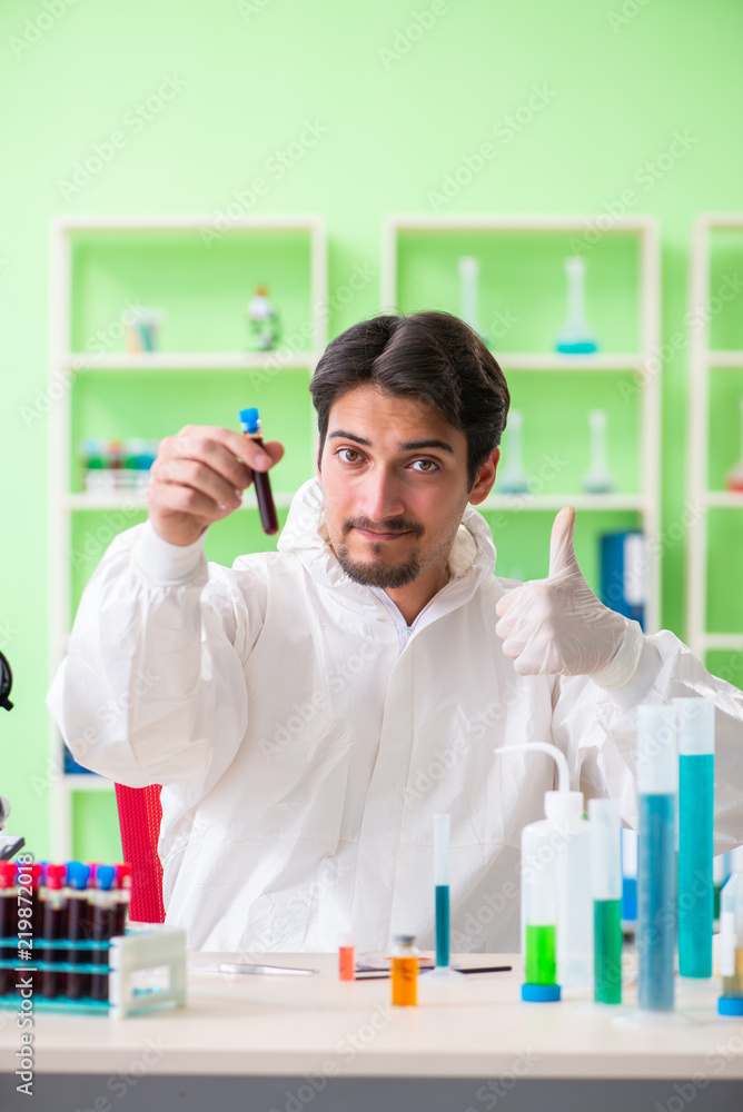 Chemist working in the lab on new experiment Chemist working in the lab on new experiment