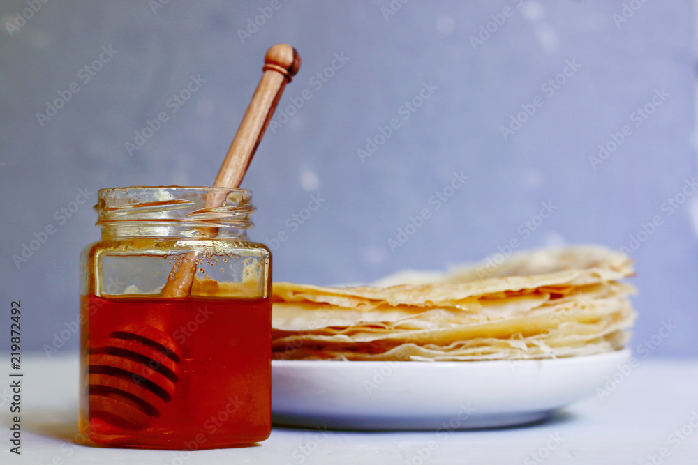 bottle of honey with stick bottle of honey with stick