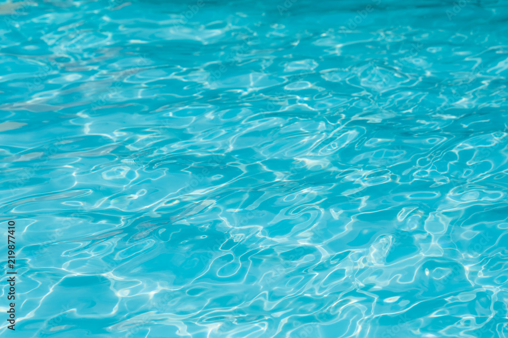Blue water surface in swimming pool for background