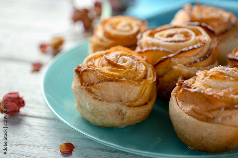 Plate with apple roses from puff pastry on table, closeup Plate with apple roses from puff pastry on table, closeup