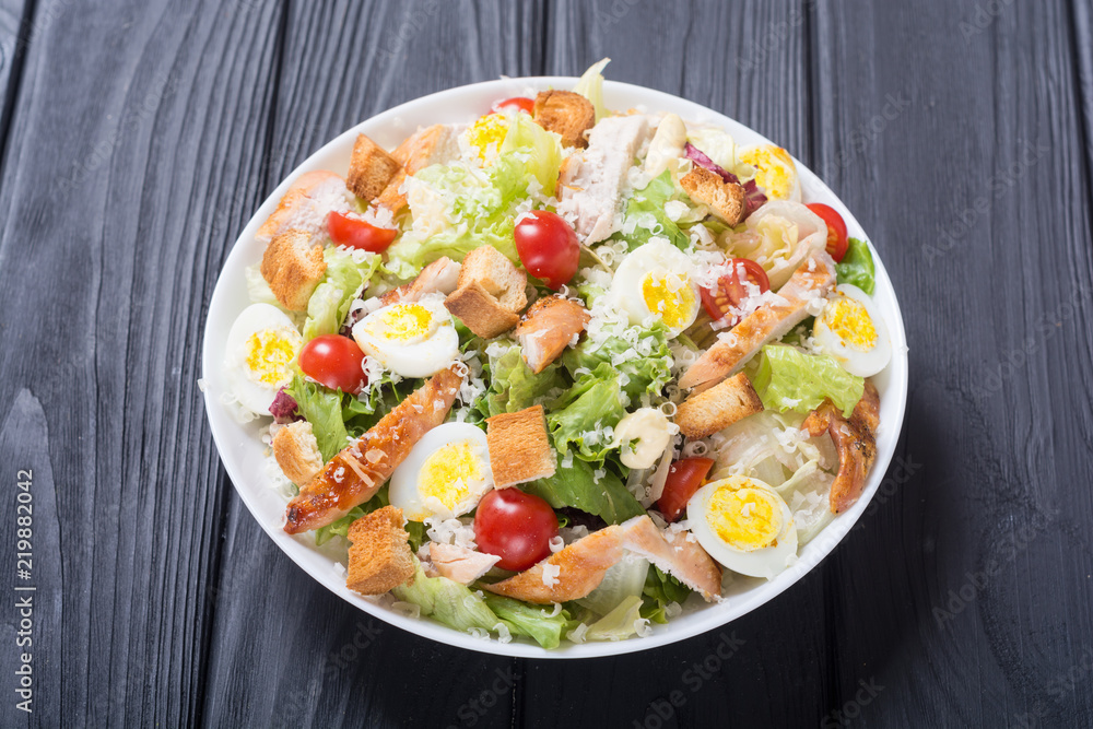 Salad ceasar with chicken , eggs and tomatoes Salad ceasar with chicken , eggs and tomatoes