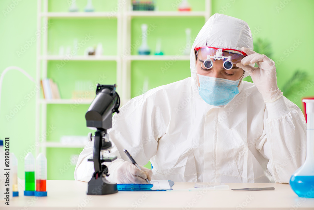 Chemist working in the lab on new experiment Chemist working in the lab on new experiment