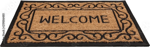 New welcome doormat on wooden floor