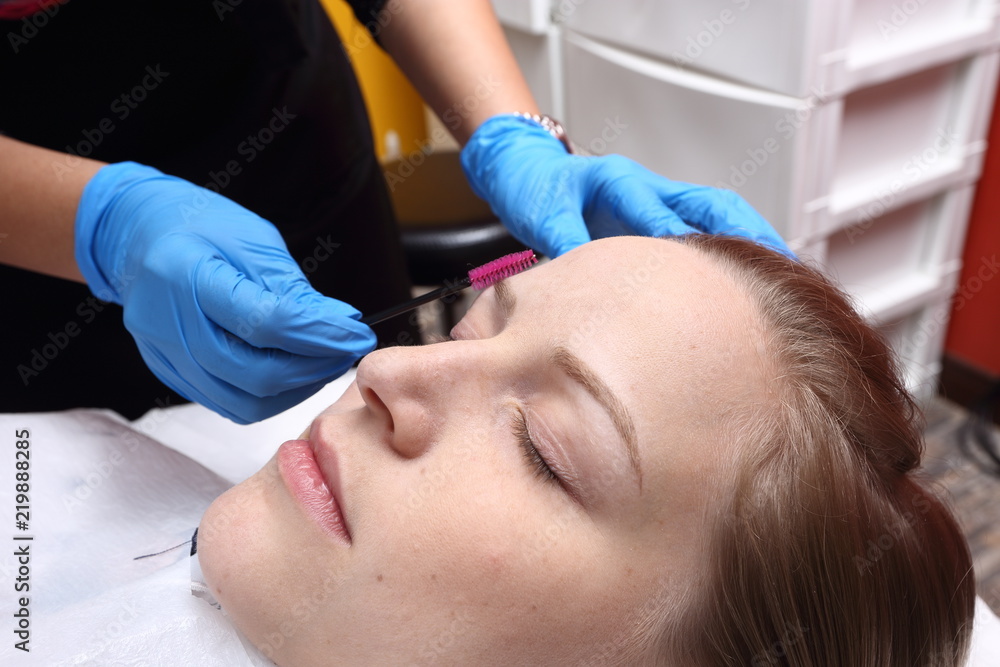 applying Tottoo, Brow Microblading to customer eyebrows applying Tottoo, Brow Microblading to customer eyebrows