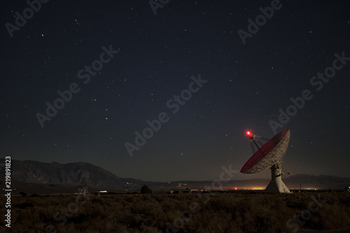 Satellite dish scanning the night sky