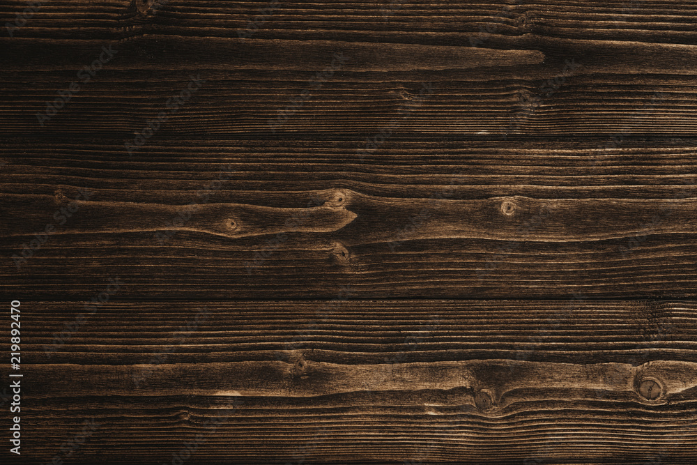 Naklejka premium Dark brown wood texture with natural striped pattern background