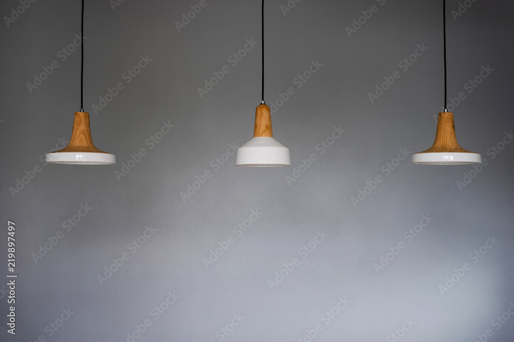 Three white ceramic lamps on the ceiling Three white ceramic lamps on the ceiling