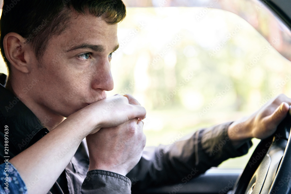 Fototapeta premium a man sitting in a car kissing a girl's hand, romantic feelings and love
