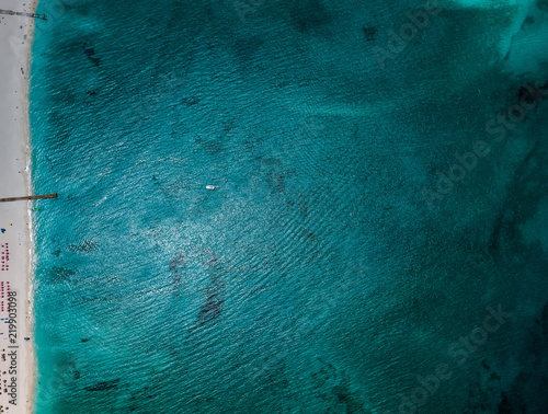 Turquoise Ocean Against Sand