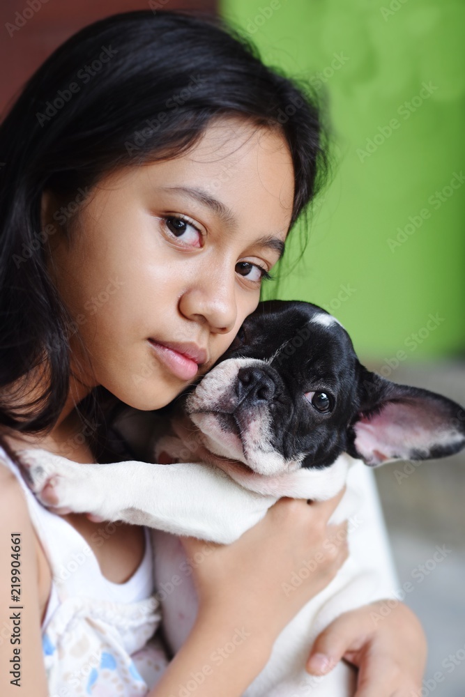 frustrated sad feeling down lonely broken heart cute asian teen girl woman hug french bulldog puppy , best friend concept with copy space frustrated sad feeling down lonely broken heart cute asian teen girl woman hug french bulldog puppy , best friend concept with copy space