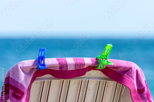 owel on the lounge chair on the beach. Relaxing on the beach.  photo