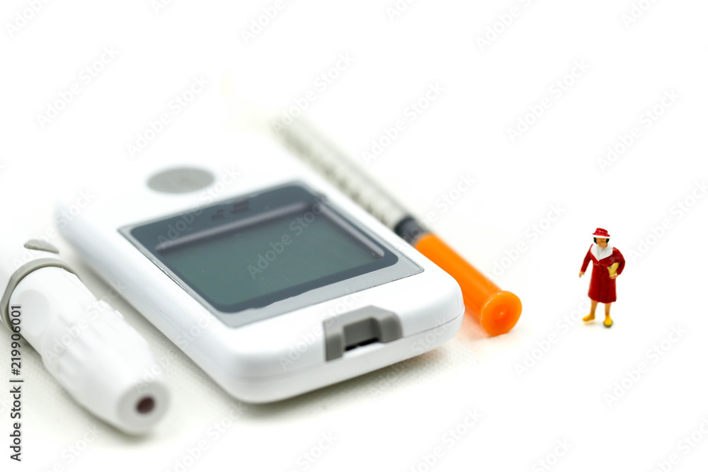 Miniature people : Doctor and patient with Glucose meter diabetes test and Syringe with measuring tape,concept of diabetes, healthy lifestyles and nutrition Miniature people : Doctor and patient with Glucose meter diabetes test and Syringe with measuring tape,concept of diabetes, healthy lifestyles and nutrition