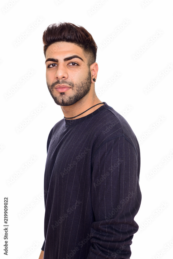 Studio shot of young handsome Indian man isolated against white Studio shot of young handsome Indian man isolated against white