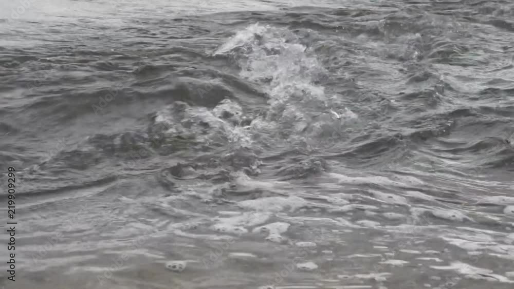 Raging clean fresh mountain river flowing between rocks in slow notion . Raging clean fresh mountain river flowing between rocks in slow notion .