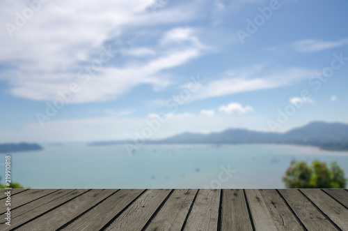 wood table top blur Sea and mountain trees