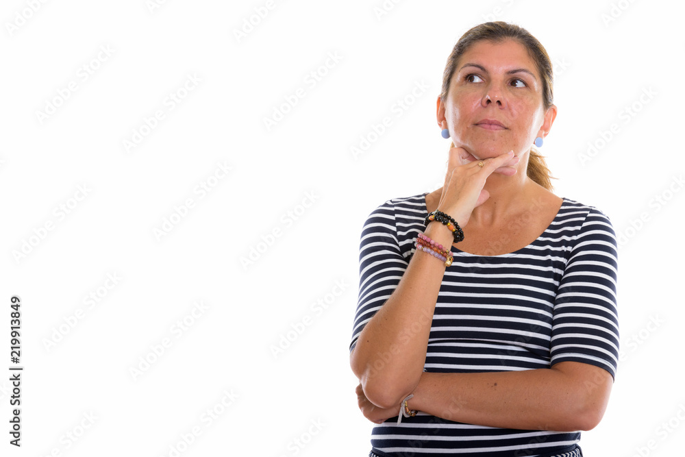 Studio shot of mature beautiful woman thinking while looking up Studio shot of mature beautiful woman thinking while looking up