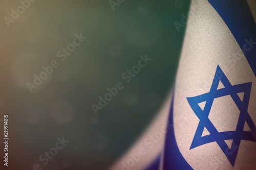 Israel flag for honour of veterans day or memorial day. Glory to the Israel heroes of war concept on light blue dark velvet background.