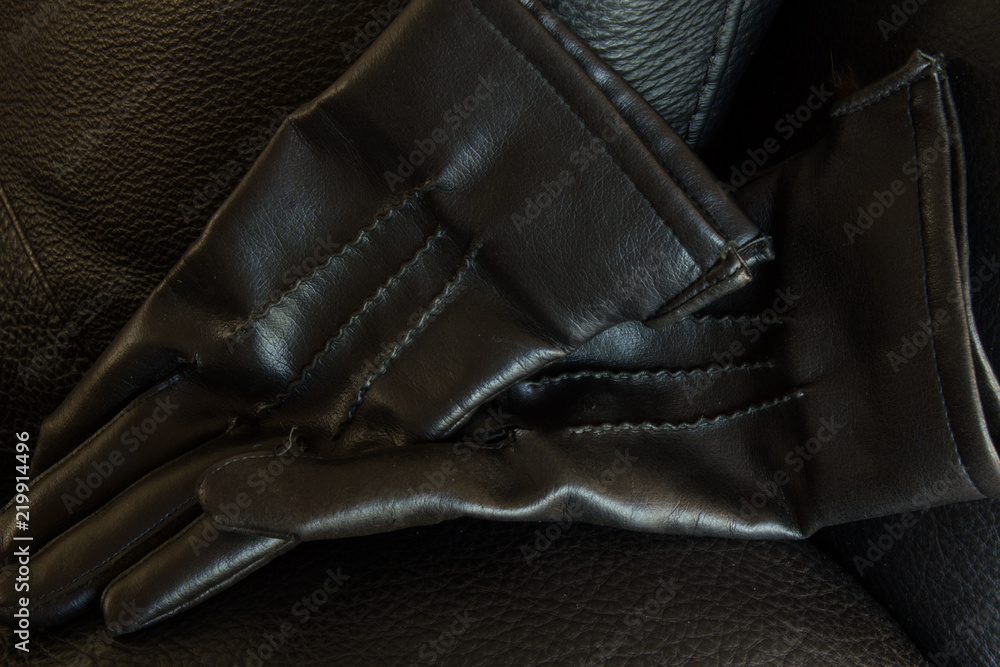 Black leather gloves, landscape orientation, with copy space. Black leather gloves, landscape orientation, with copy space.
