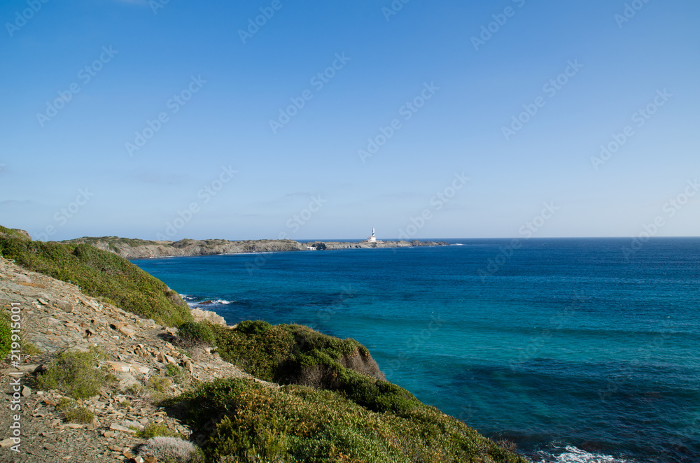 Landscape photography of one of the best known places in Menorca on the coast with a lighthouse.