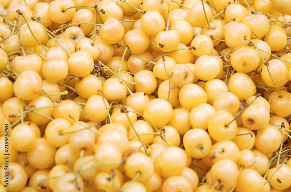 Lot of ripe yellow cherries in the supermarket. Lot of ripe yellow cherries in the supermarket.