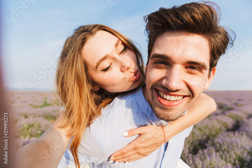 Cheerful young couple taking a selfie
