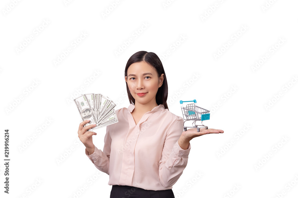 retail commercial business concept, Asian beautiful woman holding banknote money in hand and shopping cart in another hand isolated on white background with clipping path retail commercial business concept, Asian beautiful woman holding banknote money in hand and shopping cart in another hand isolated on white background with clipping path