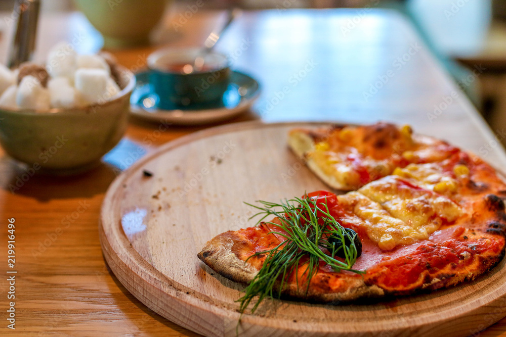 mini pizza on wooden backing
