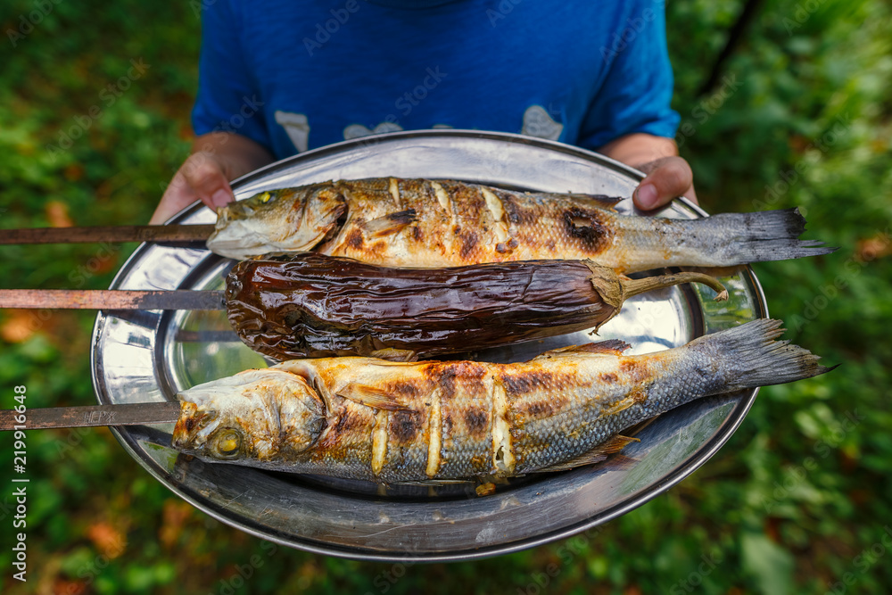 grilled fish food. grill from a sea bass. seabass on skewers