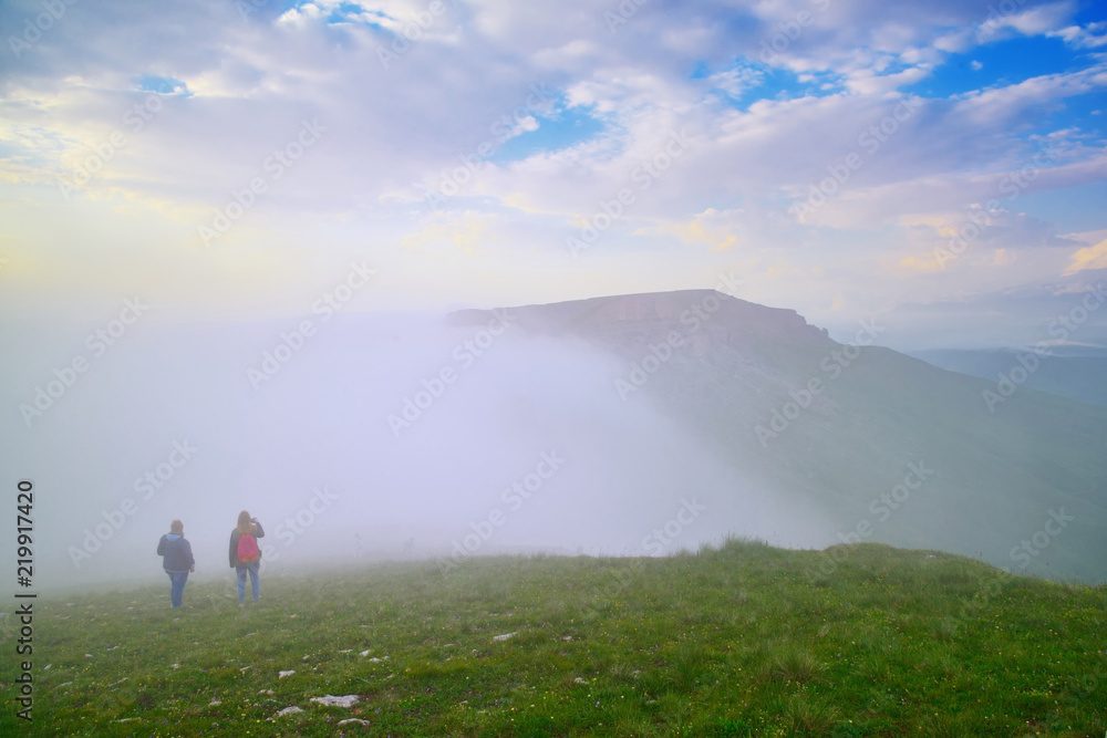 Naklejka premium Tourists on the plateau Bermamyt, North Caucasus.