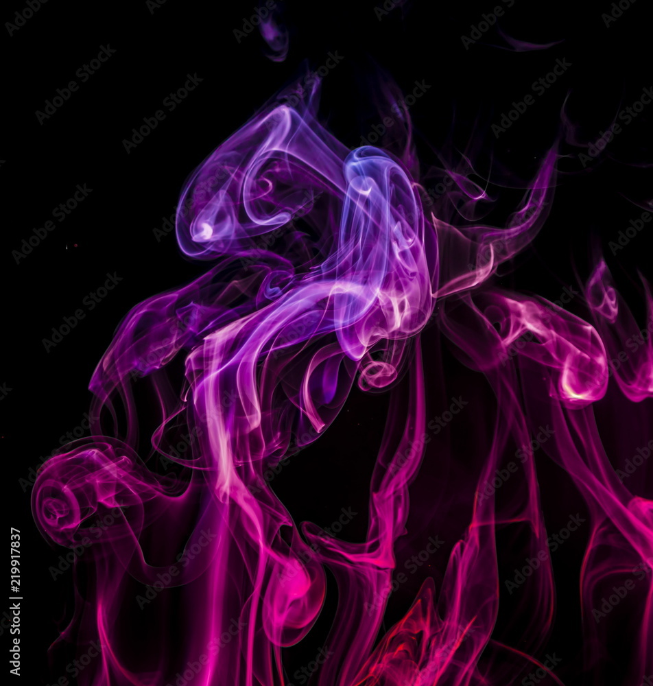 Fototapeta premium Colored smoke on black background
