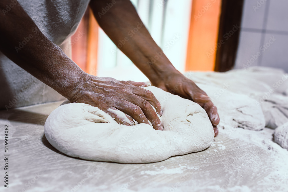 Knead bread in a traditional bakery