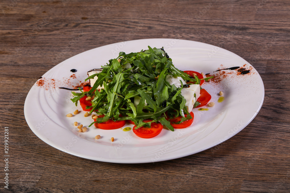 Caprese salad with arugula Caprese salad with arugula
