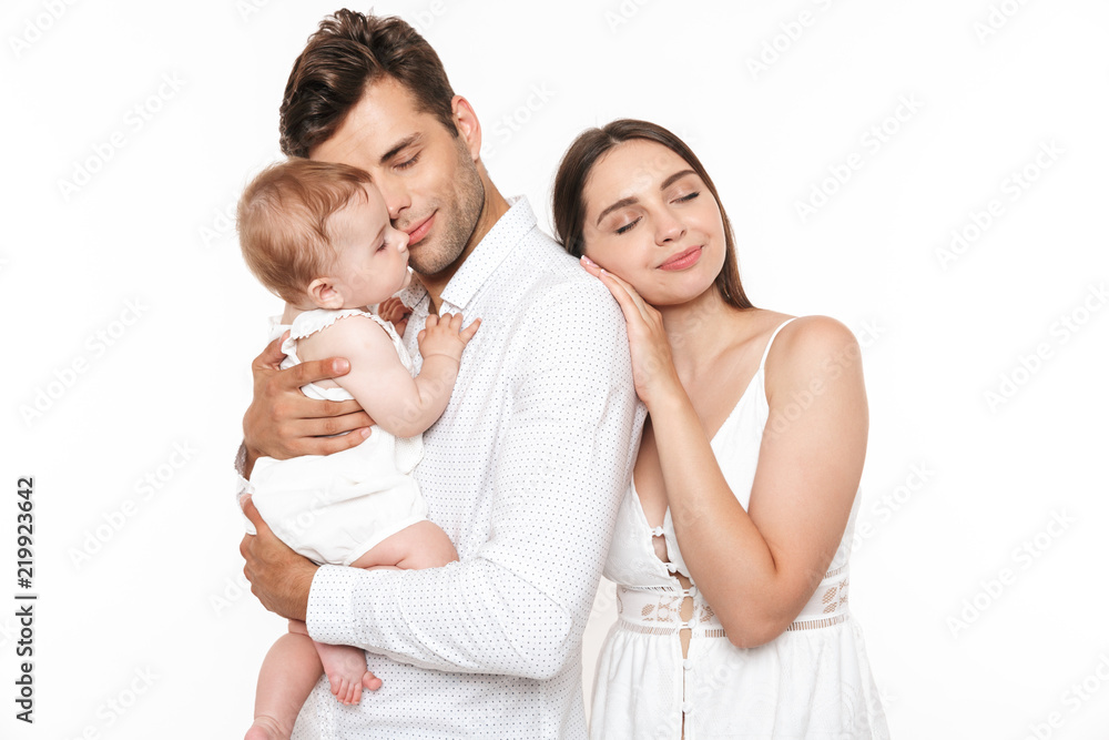 Portrait of a smiling young family with their little baby girl Portrait of a smiling young family with their little baby girl