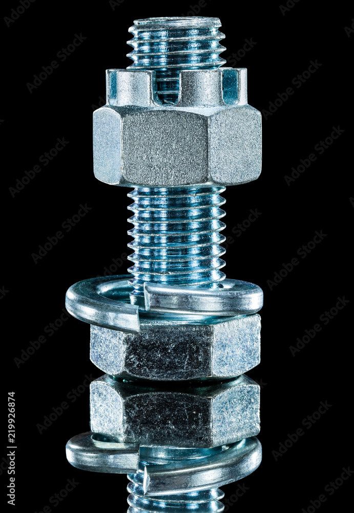 Construction nut screwbolt spring washer on black surface Construction nut screwbolt spring washer on black surface