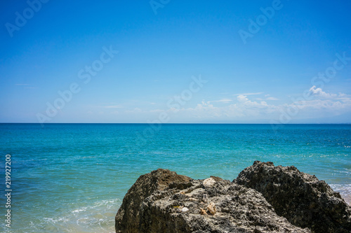 big stone rock blue ocean and sky