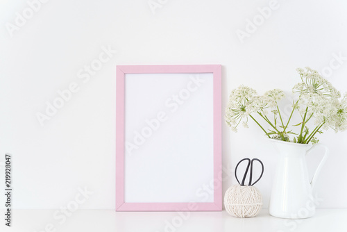 Vintage pink frame mock up with a Aegopodium in jug. Mockup for design. Template for businesses, bloggers, social media. Posterr mockup photo