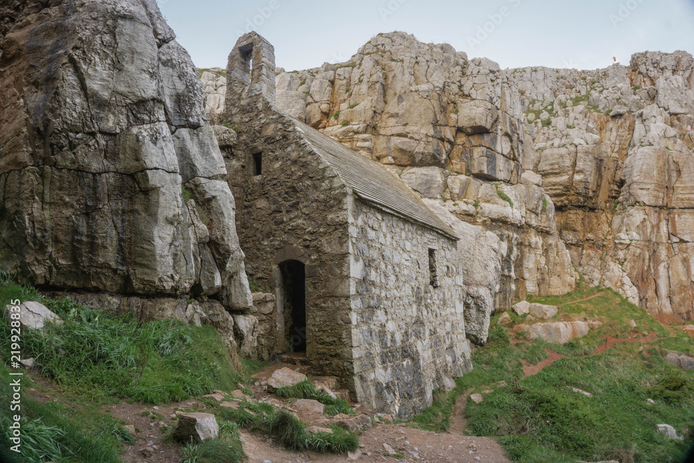 Tiny St Govan's Chapel built on the cliffs of the Pembrokeshire National Park in South Wales