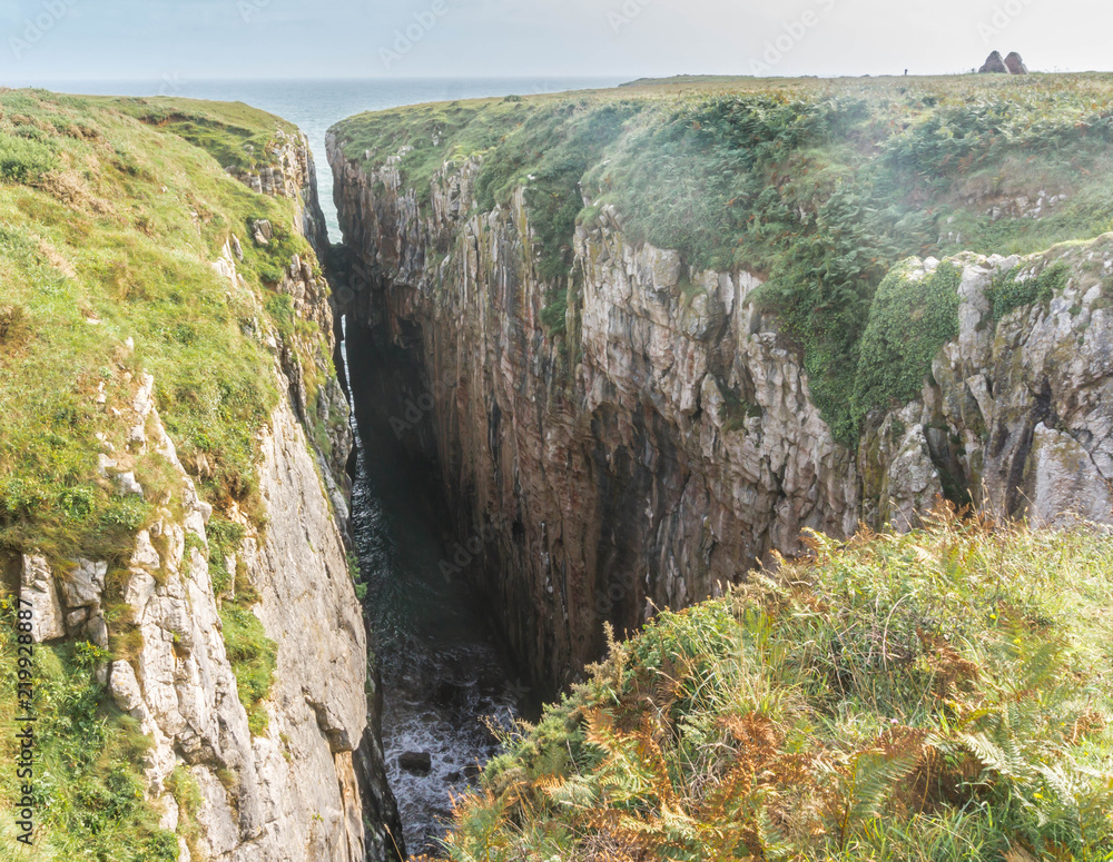 Huntsman's Leap sheer-sided coastal chasm on the Pembrokeshire Coast in  South Wales Stock Photo | Adobe Stock