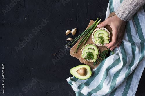 Vegan breakfast rice tortillas avocado tomato spices onions photo