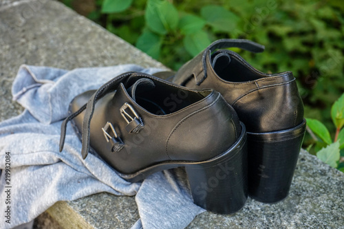 empty pair of black woman shoes outdoor
