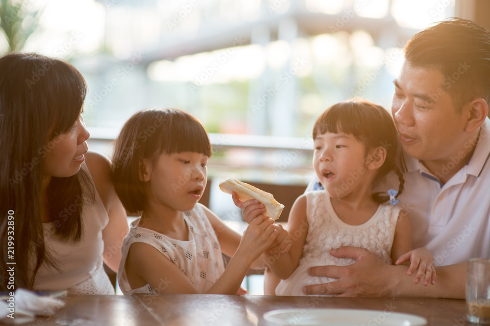 Asian family having meal at cafe Asian family having meal at cafe