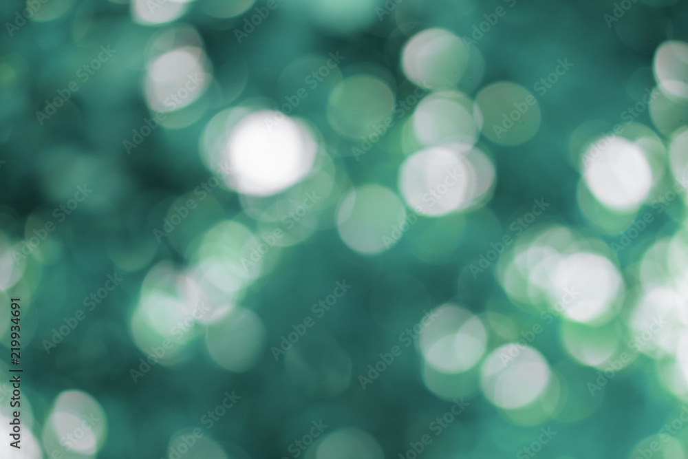 Turquoise and blue blurred bokeh lights background