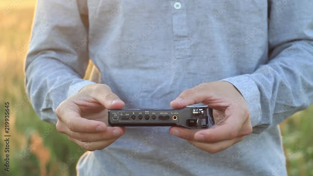 Hands is holding voise recorder. Zoom h1 Hands is holding voise recorder. Zoom h1